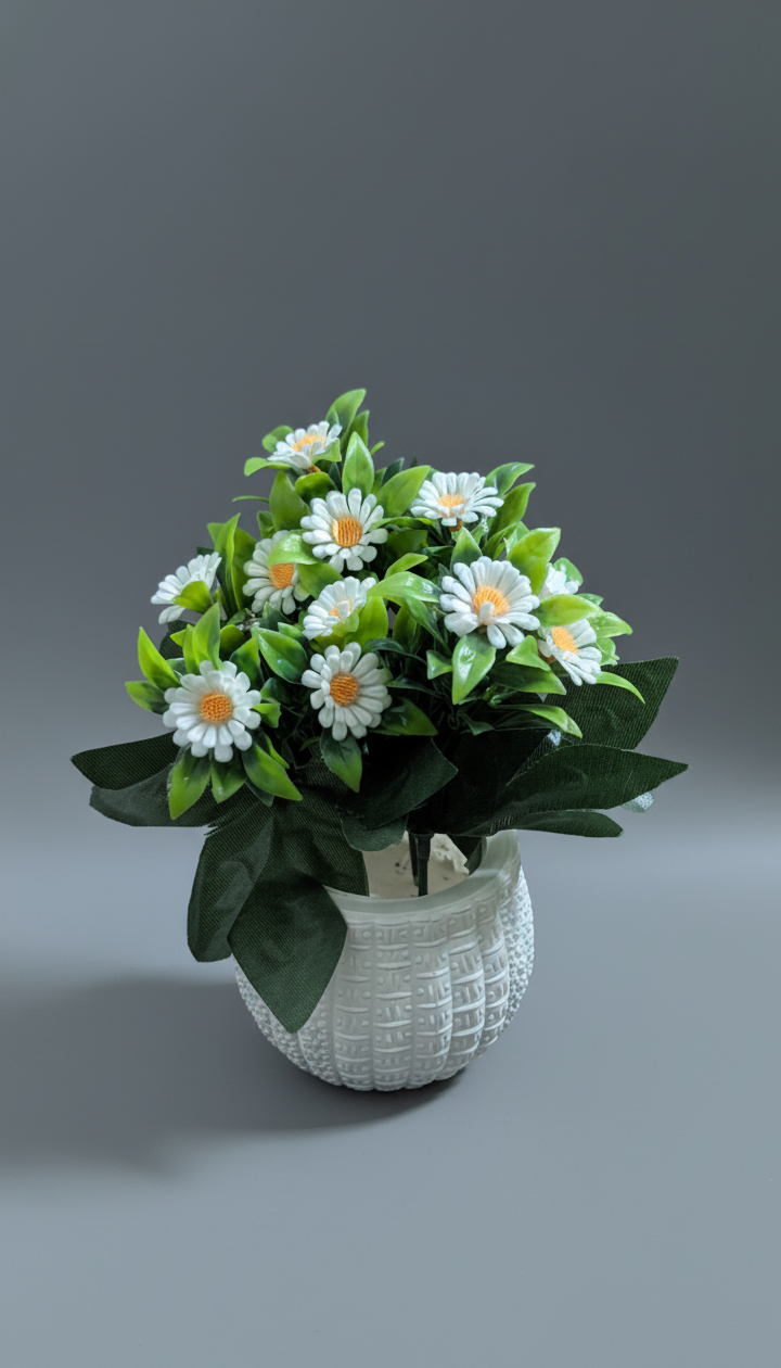 Potted plant with white and yellow flowers with green leaves 